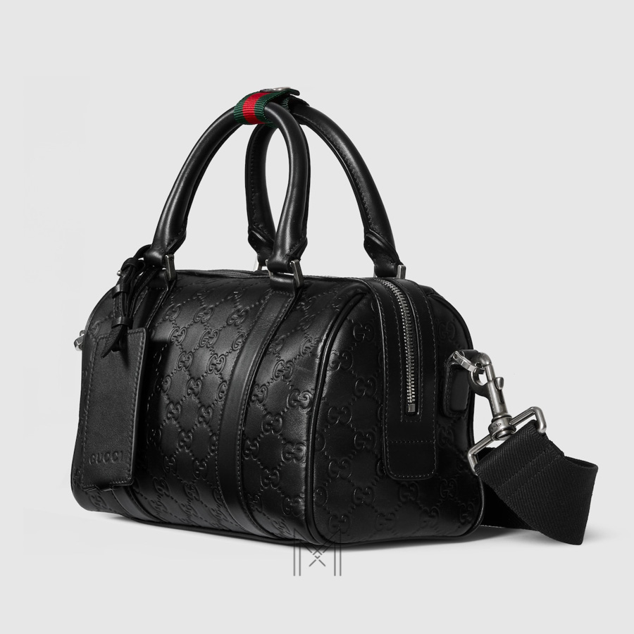 Túi xách đeo chéo Gucci Emblem small duffle màu đen hoạ tiết dập nổi TGG45 2026 Túi xách đeo chéo Gucci Emblem small duffle màu đen hoạ tiết dập nổi TGG45 2026