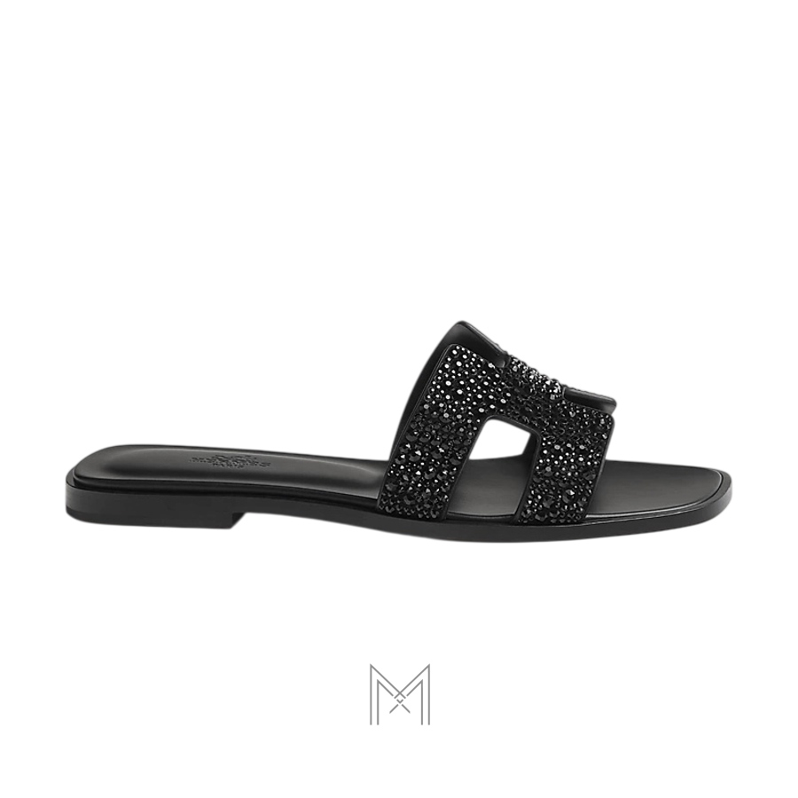 Dép quai ngang Hermes Oran chính hãng đính đá màu đen MHHH054 2026 Dép quai ngang Hermes Oran chính hãng đính đá màu đen MHHH054 2026