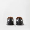 Giày Versace Mick Leather Derby màu đen phối trắng hàng hiệu MGV104 2026 Giày Versace Mick Leather Derby màu đen phối trắng hàng hiệu MGV104 2026