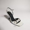 Sandal Gucci cao gót màu trắng khóa Horsebit bạc chính hãng MHDG009 2026 Sandal Gucci cao gót màu trắng khóa Horsebit bạc chính hãng MHDG009 2026