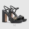 Sandal Gucci cao gót màu đen logo vàng chính hãng MHDG025 2026