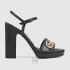 Sandal Gucci cao gót màu đen logo vàng chính hãng MHDG025 2026