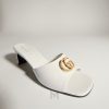 Dép Gucci cao gót màu trắng logo GG vàng chính hãng MHDG005 2026 Dép Gucci cao gót màu trắng logo GG vàng chính hãng MHDG005 2026