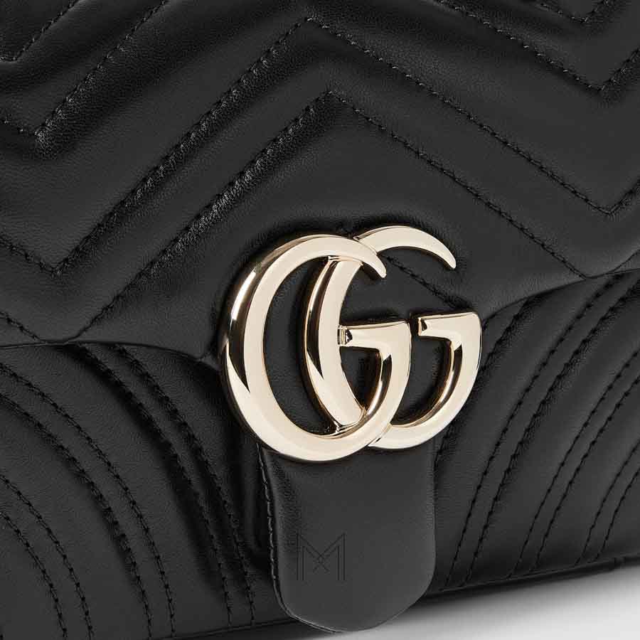 Túi xách đeo chéo Gucci Marmont màu đen dây xích vàng authentic MHTG109 2026 Túi xách đeo chéo Gucci Marmont màu đen dây xích vàng authentic MHTG109 2026